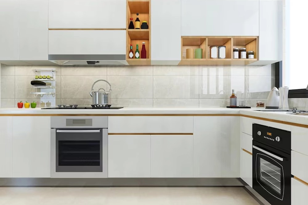 Clean modern kitchen with white cabinets, wall oven and open wood shelving
